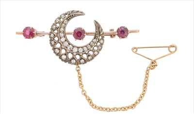 Lot 33 - A ruby and diamond crescent brooch