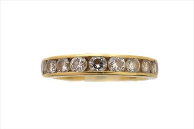 Lot 140 - An 18ct gold diamond band ring