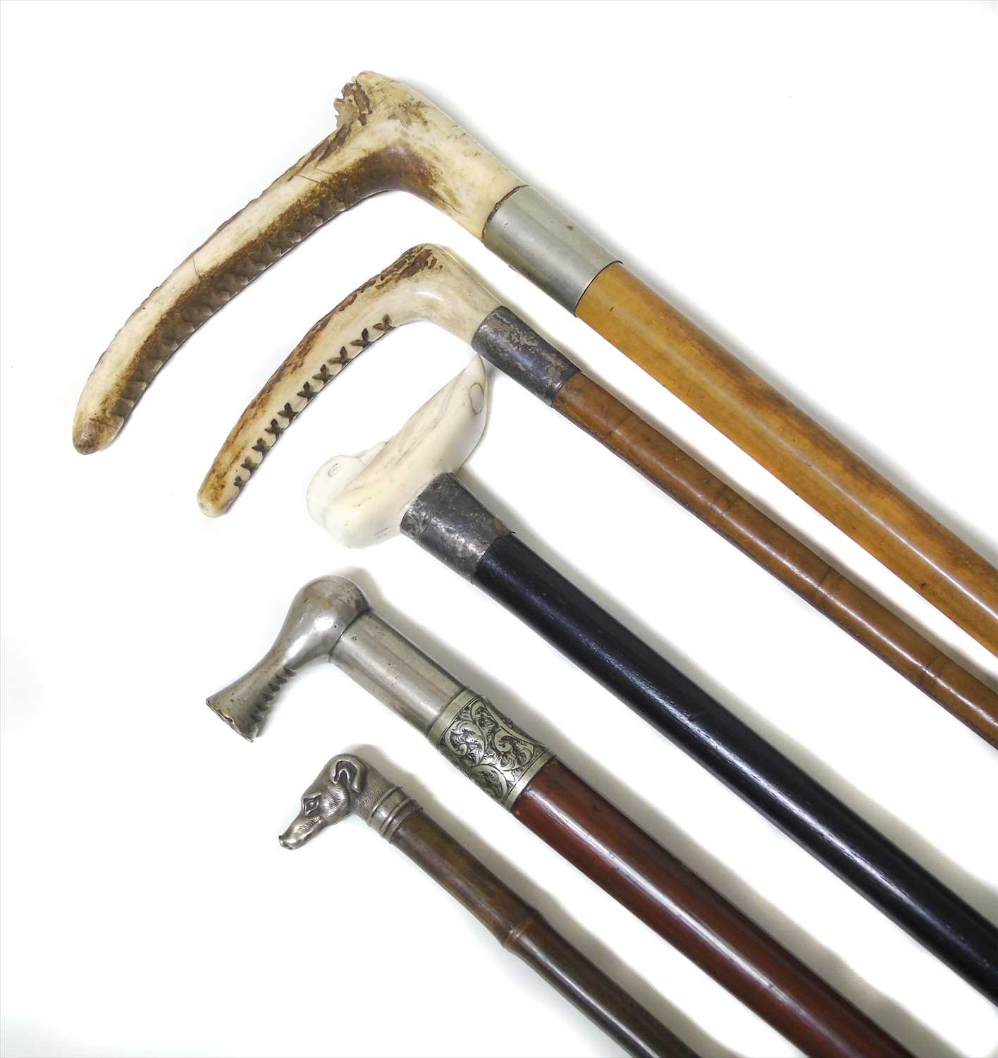 Lot 84 - A collection of hunting whips and canes