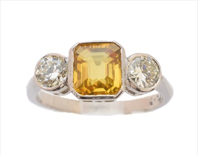 Lot 225 - A sapphire and diamond three stone ring