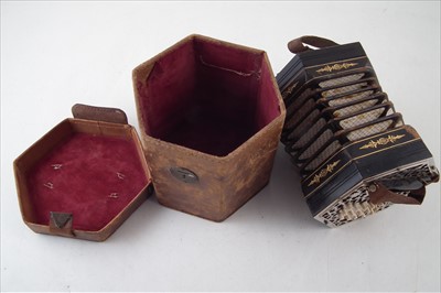 Lot 28 - Thirty key Anglo concertina with leather case
