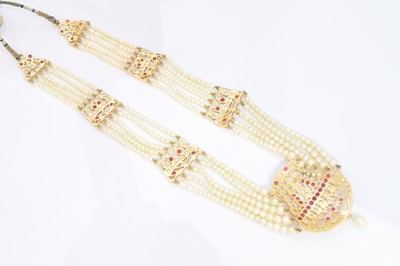 Lot 94 - A natural pearl and ruby necklace