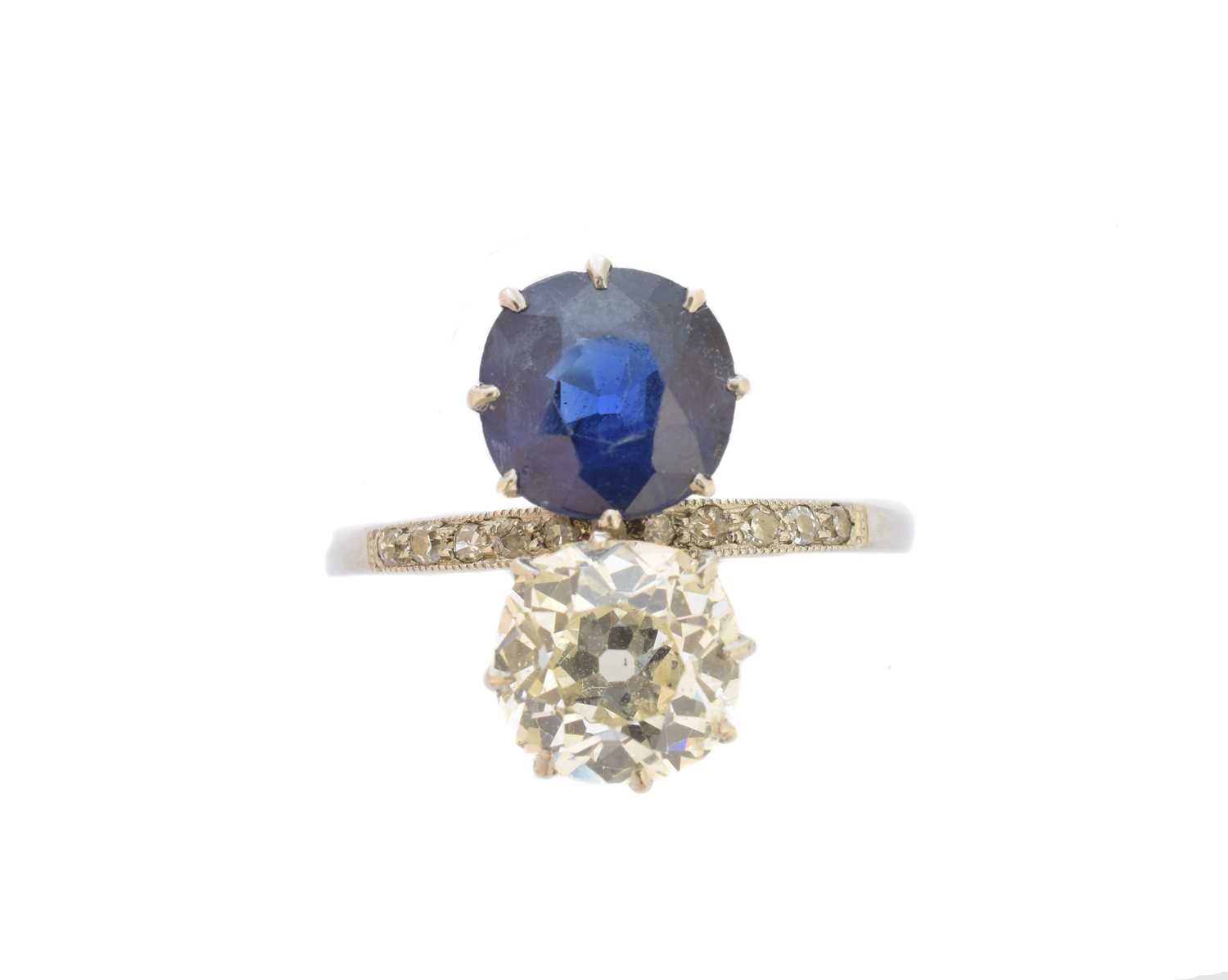 Lot 184 - An early 20th century diamond and Basaltic sapphire toi et moi ring