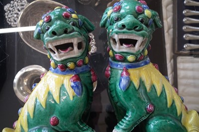 Lot 136 - Pair of Chinese Dogs of Foo, a moon flask and three rice spoons.