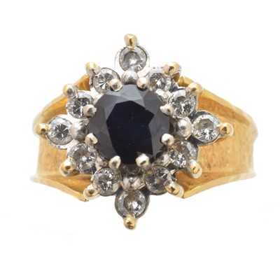 Lot 183 - An 18ct gold sapphire and diamond cluster ring