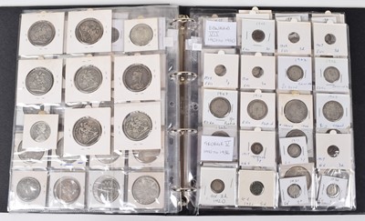 Lot 74 - One album of historical mainly silver British coinage dating from George II through to George VI.