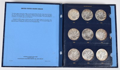 Lot 15 - One album of United States Silver Eagles, 1986-2010.