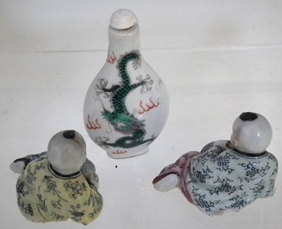 Lot 129 - Pair of Chinese porcelain figures and a snuff bottle