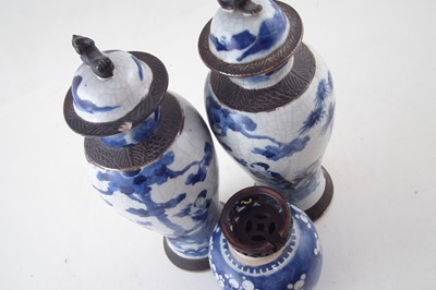 Lot 77 - Chinese ginger jar with pierced wood lid, also a pair of lidded vases with crackle glaze.