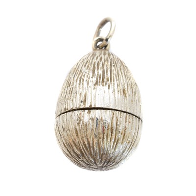 Lot 62 - A silver and enamel egg pendant by Stuart Devlin