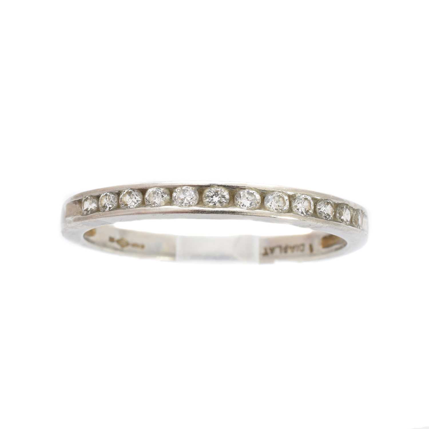 Lot 186 - A platinum diamond half eternity ring