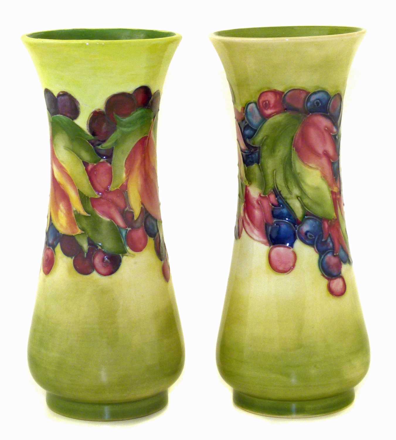 Lot 102 - Pair of Moorcroft leaf and berry vases