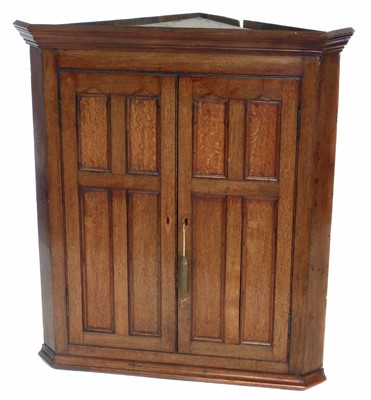 Lot 190 - George III two door oak corner cupboard, 108cm (43") high.