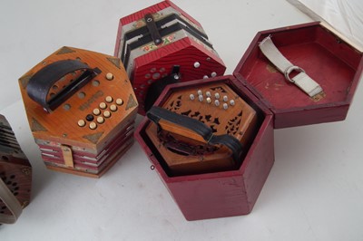 Lot 48 - Four Concertinas, one with case.