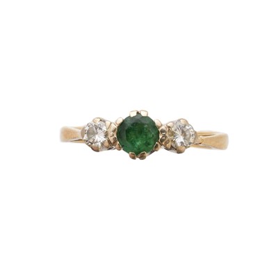 Lot 153 - An 18ct gold emerald and diamond three stone ring