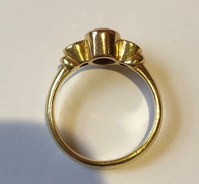 Lot 162 - A 'brown' diamond and diamond three stone ring
