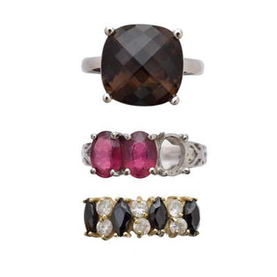 Lot 124 - Three gem-set dress rings