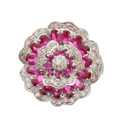 Lot 125 - A ruby and diamond cluster ring