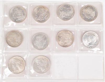 Lot 4 - One sheet of silver Morgan and Peace Dollars (10).