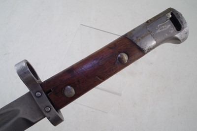 Lot 257 - Four bayonets, a machete and a truncheon