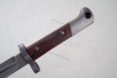 Lot 257 - Four bayonets, a machete and a truncheon