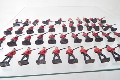 Lot 221 - Forty four British army metal soldiers by J. Hill and Co. and Britains.