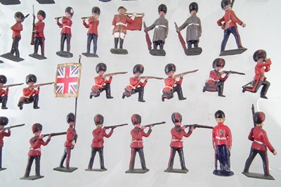 Lot 221 - Fifty seven metal British infantry soldiers by J. Hill and Co. and twelve mounted troopers.