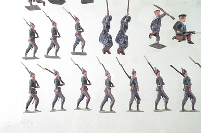 Lot 32 - Fifteen metal Prussian infantry soldiers, also twenty British Marines, and an artillery unit.