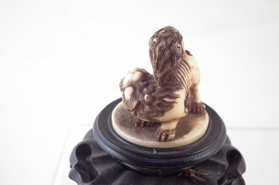 Lot 58 - Japanese Ivory netsuke carved as a karashishi