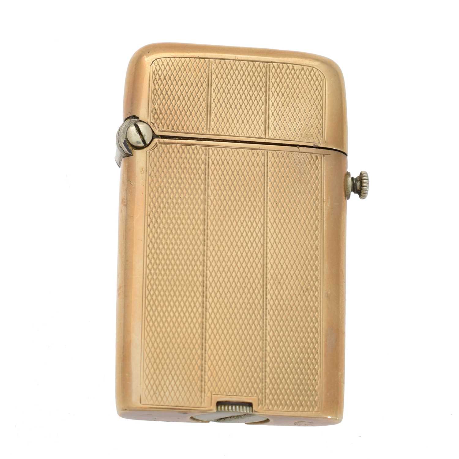 Lot 108 - A yellow metal lighter by Thorens