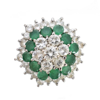 Lot 205 - An emerald and diamond cluster ring