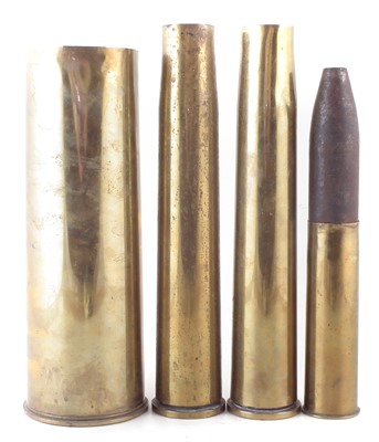 Lot 318 - Two pounder round and three shell cases
