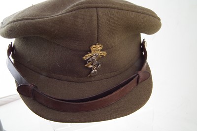 Lot 268 - Italian WWII helmet, replica German helmet and a British REME Cap