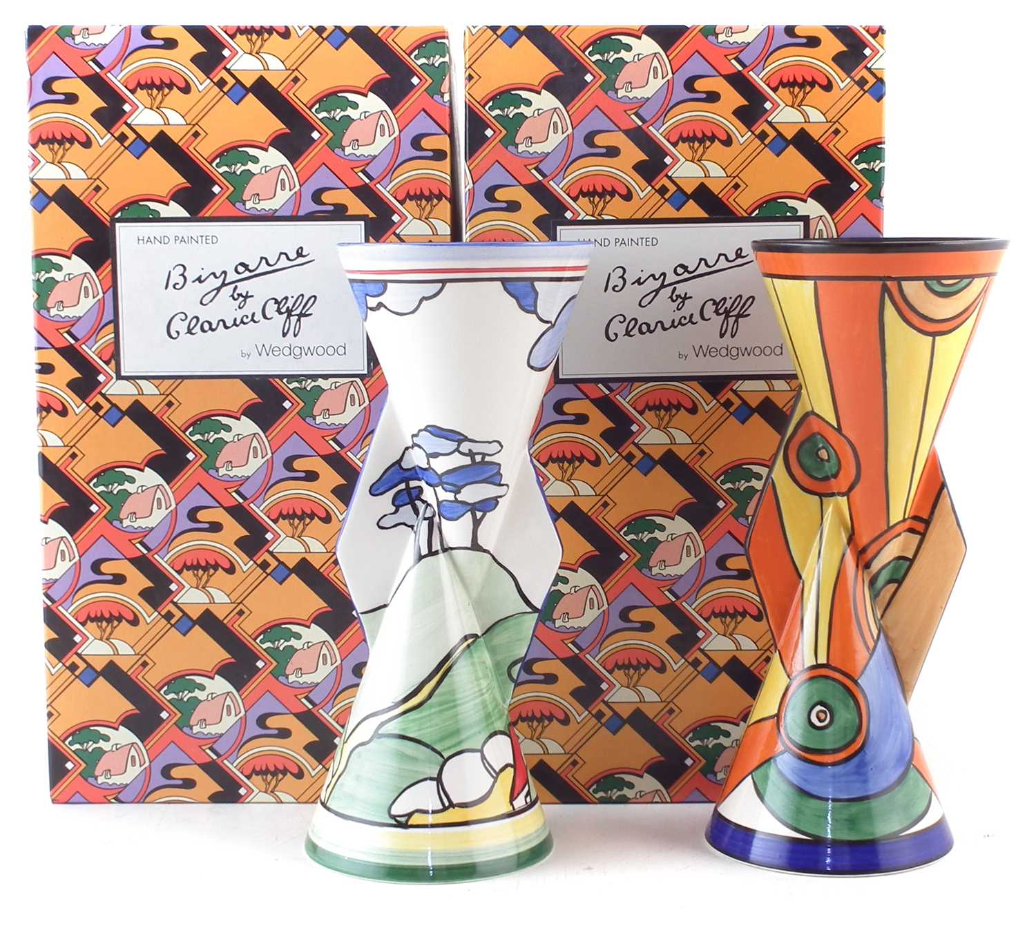 Lot 120 - Two Wedgwood Clarice Cliff Yo-Yo vases, boxed, decorated with Sliced Circle and Blue Firs patterns.