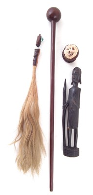 Lot 230 - African Knobkerrie, fly whisk figure and an Asian carved pierced ball.