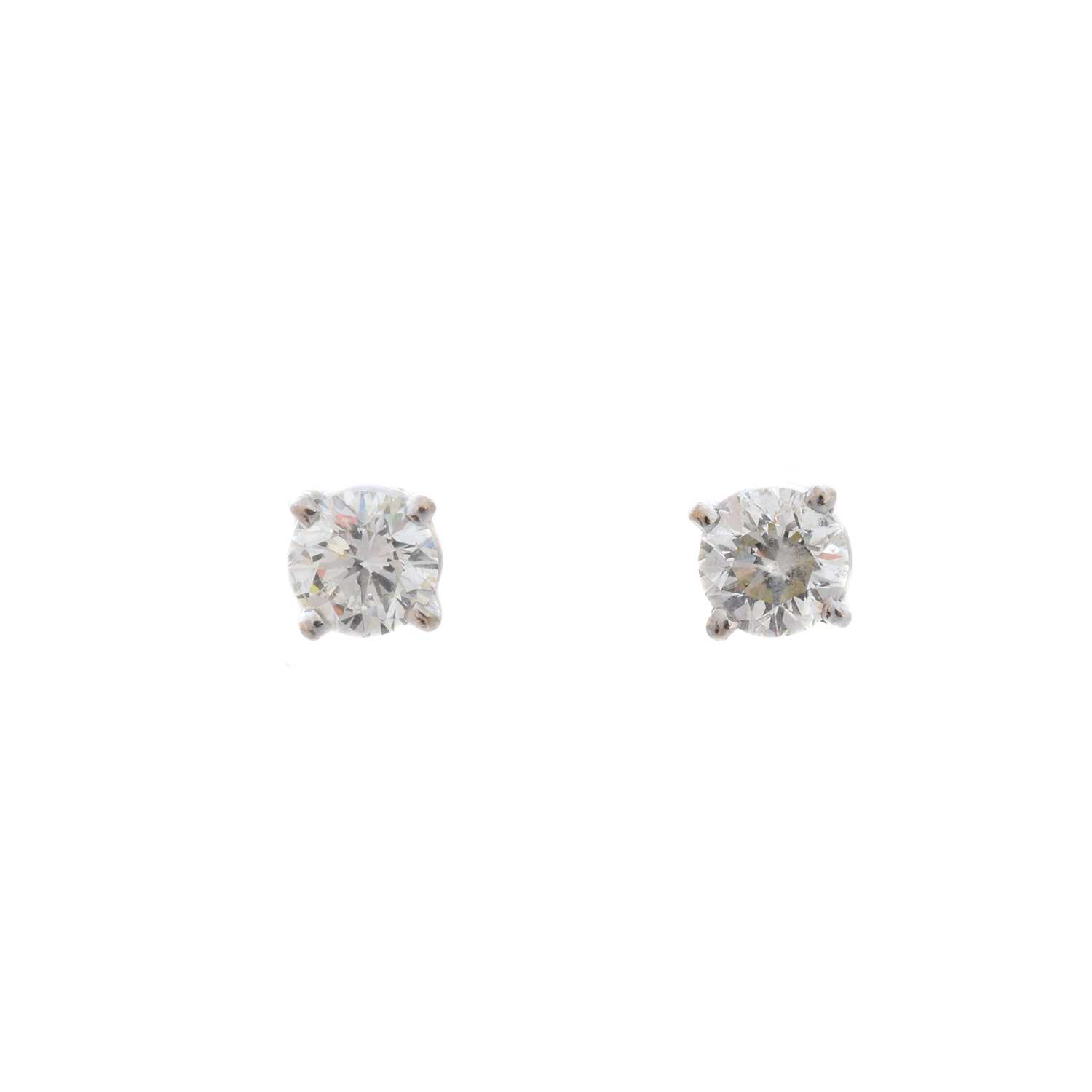 Lot 70 - A pair of brilliant-cut diamond stud earrings