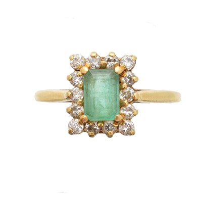 Lot 167 - An 18ct gold emerald and diamond cluster ring