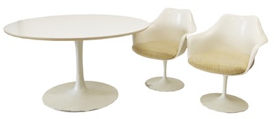 Lot 214 - Eero Saarinen design dining table and seven armchairs