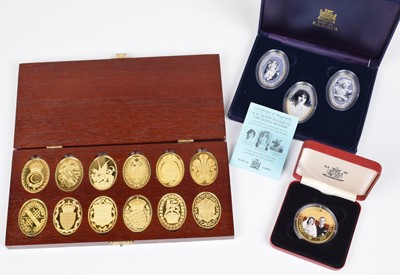 Lot 8 - A cased set of twelve hallmarked silver gilt medallions and other cased gold-plated coin sets.