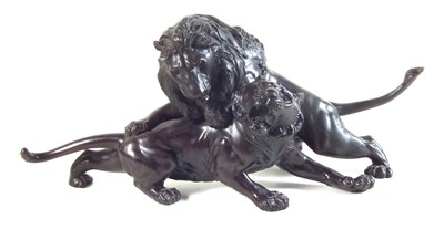 Lot 74 - Twentieth century Japanese bronze model of a lion attacking a tiger.