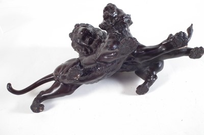 Lot 74 - Twentieth century Japanese bronze model of a lion attacking a tiger.
