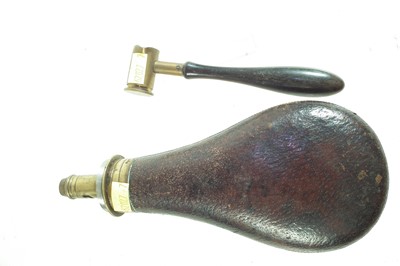 Lot 212 - Dixon and Sons powder flask and a measure