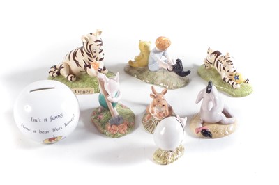 Lot 123 - Seven Royal Doulton Winnie the Pooh boxed figures and a money box