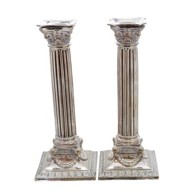 Lot 132 - A pair of silver plated candlesticks
