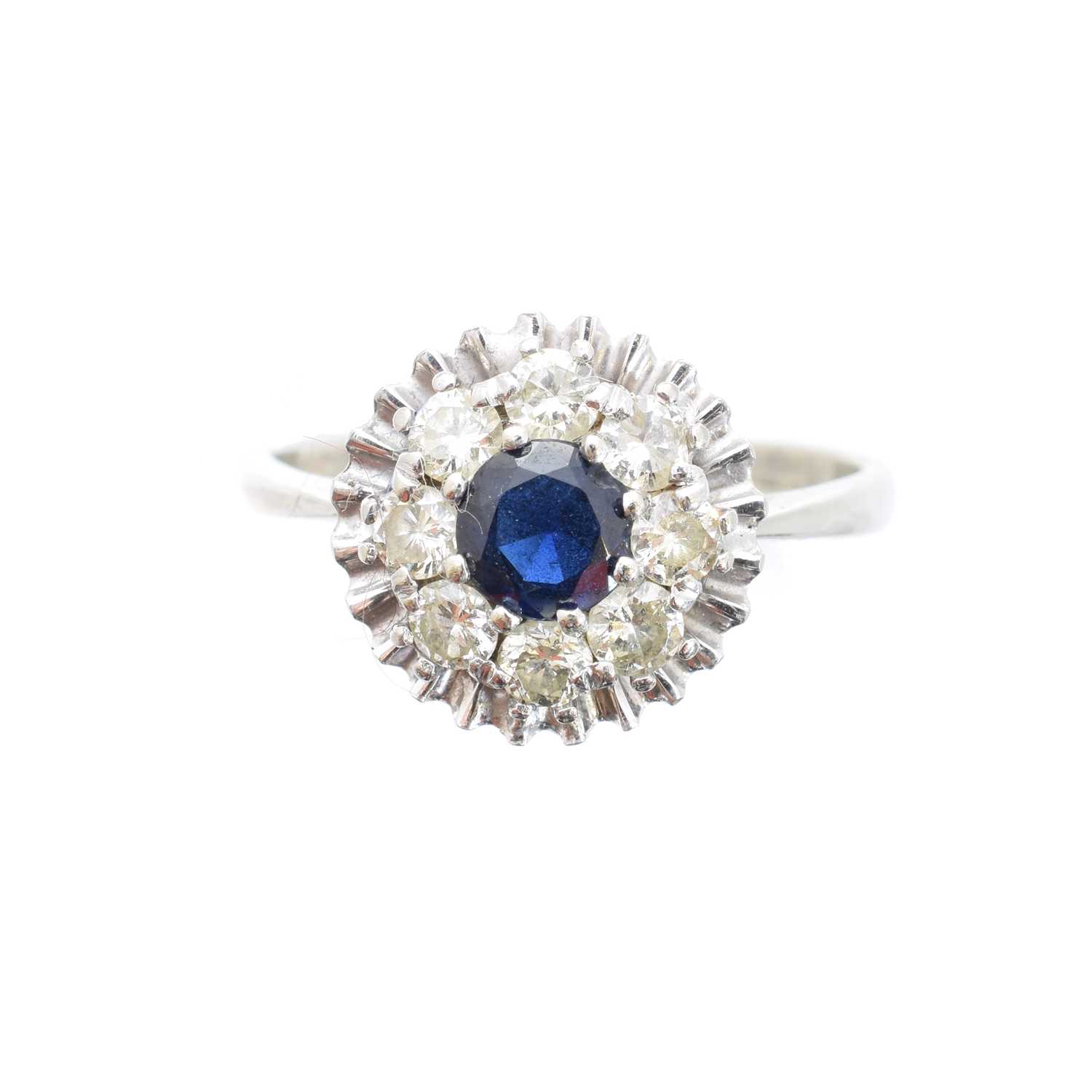 Lot 41 - A sapphire and diamond cluster ring