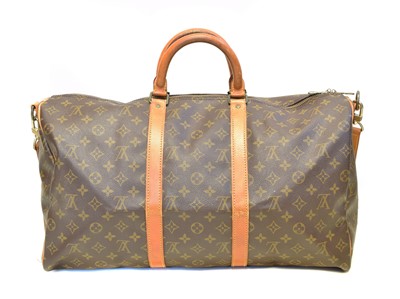 Lot 45 - A Louis Vuitton monogram Keepall Bandoulière 55 luggage bag