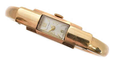 Lot 252 - A 9ct gold Olma watch bangle