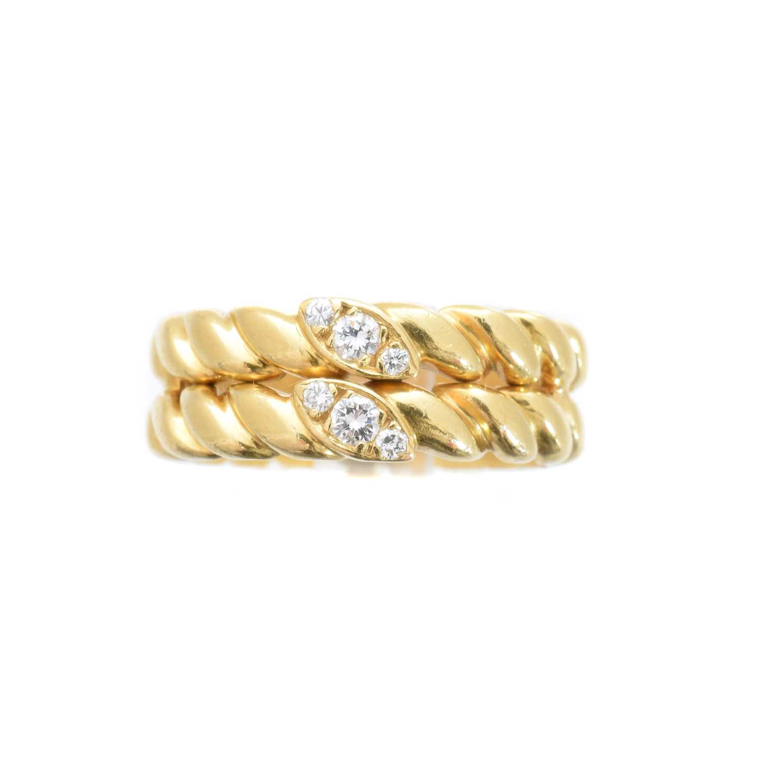 Lot 199 - An 18ct gold diamond band ring by Van Cleef & Arpels