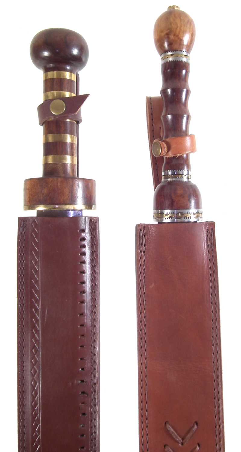 Lot 357 - Two modern replicas of a Roman Sparta cavalry sword and scabbard
