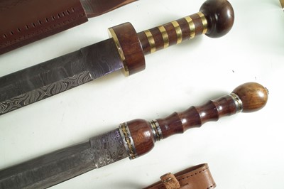 Lot 357 - Two modern replicas of a Roman Sparta cavalry sword and scabbard